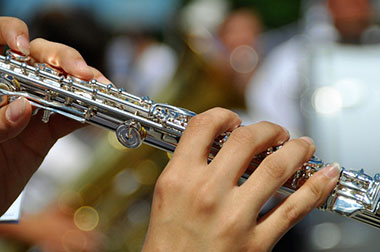 Woman plays on flute